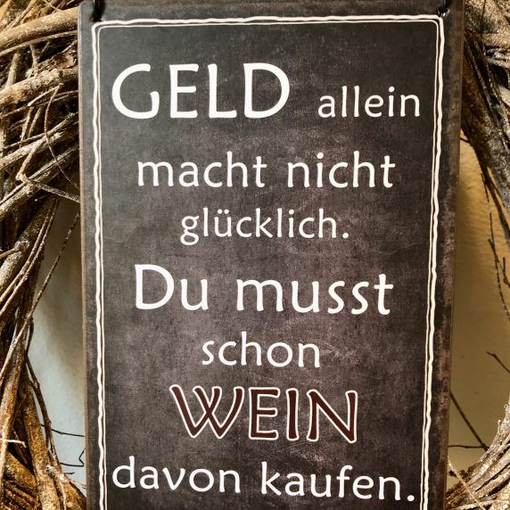 Schild Geld allein macht nicht glücklich